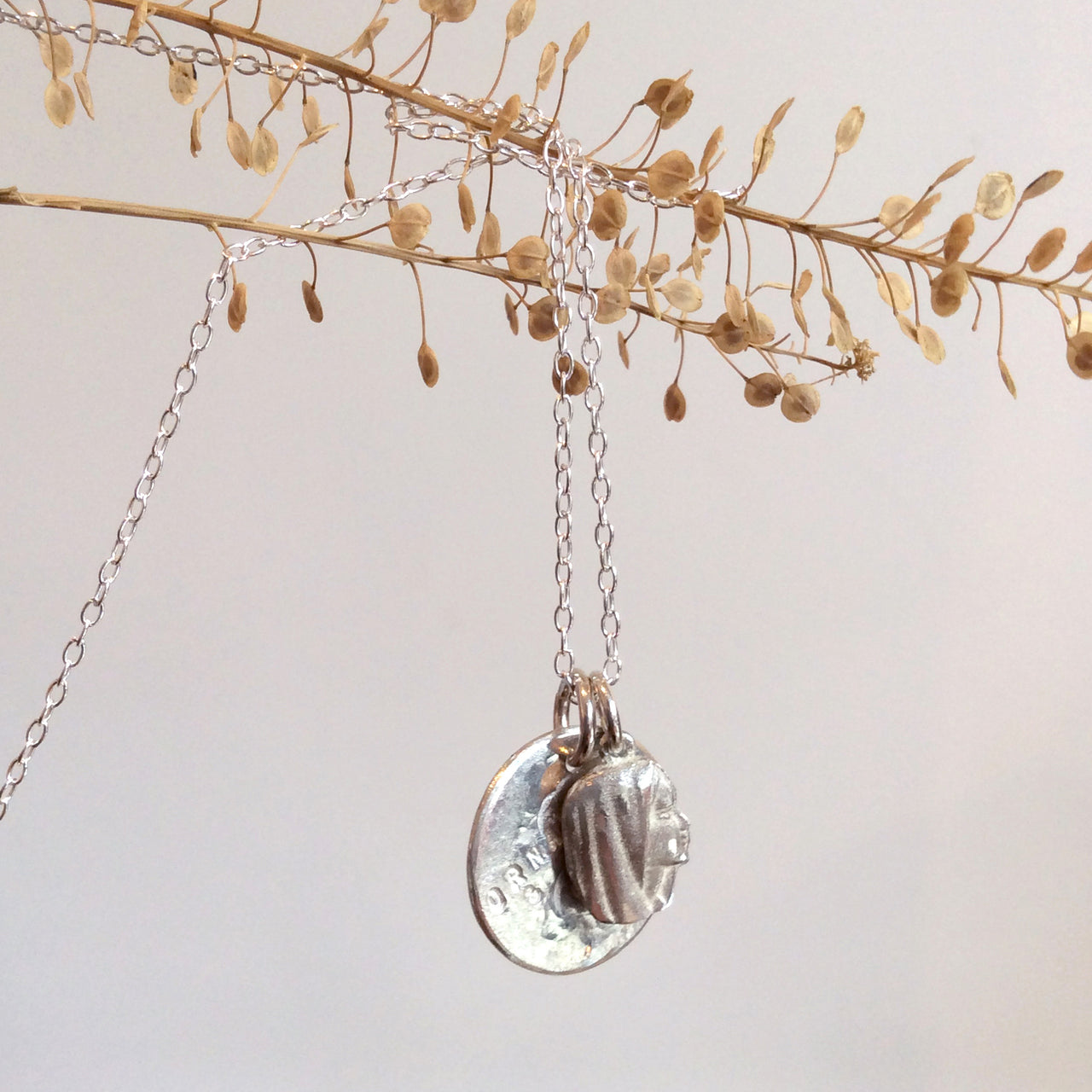 ORNAMENT & CRIME NECKLACE WITH ROUND & GIRL CHARMS